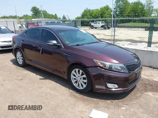 2015 Kia Optima EX z VIN 5XXGN4A75FG477890, wystawiony jako IAAI lot #42383566 z przebiegiem 185 718 mil mil oraz . Historia ofert i sprzedaży dostępna na DreamBid. Obrazek 1.