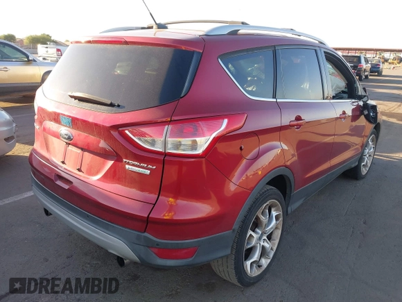 2013 Ford Escape Titanium with VIN 1FMCU0J96DUA57425, listed as a IAAI auction lot 40458653 with 121,929 mi miles. Bid and sale history available at carsss.com. Image 4.