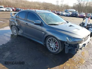 2008 Mitsubishi Lancer Evolution GSR with VIN JA3AW86V18U044077, listed as a IAAI auction lot 41208625 with 157,788 mi miles. Bid and sale history available at carsss.com. Image 1.
