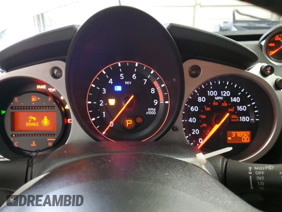 2013 Nissan 370Z Touring z VIN JN1AZ4EH5DM383466, wystawiony jako Copart lot #85704054 z przebiegiem 37 892 mil mil oraz Szkoda całkowita • Salvage title. Historia ofert i sprzedaży dostępna na DreamBid. Obrazek 9.