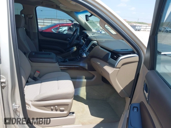 2015 Chevrolet Tahoe LS with VIN 1GNSCAKC9FR294832, listed as a IAAI auction lot 39274877 with 126,932 mi miles and . Bid and sale history available at DreamBid. Image 5.