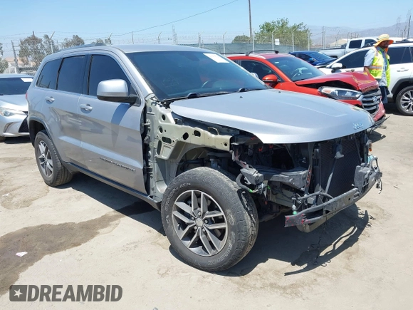 2018 Jeep Grand Cherokee Laredo E with VIN 1C4RJEAG2JC429850, listed as a IAAI auction lot 42541574 with 72,009 mi miles and . Bid and sale history available at DreamBid. Image 1.