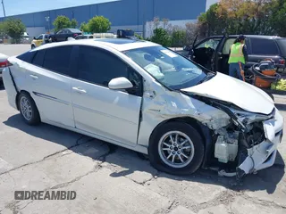 2018 Toyota Prius Two z VIN JTDKARFU8J3054828, wystawiony jako IAAI lot #42280020 z przebiegiem 137 013 mil mil oraz . Historia ofert i sprzedaży dostępna na DreamBid. Obrazek 1.