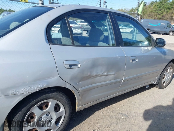 2003 Hyundai Elantra GLS z VIN KMHDN45D23U700908, wystawiony jako IAAI lot #42133529 z przebiegiem 100 955 mil mil oraz . Historia ofert i sprzedaży dostępna na DreamBid. Obrazek 6.