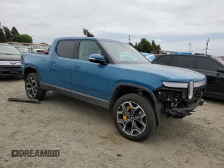 2023 Rivian R1T Launch Edition with VIN 7FCTGAAL7PN019188, listed as a Copart auction lot 55100405 with 13,654 mi miles and Salvage Title. Bid and sale history available at DreamBid. Image 4.