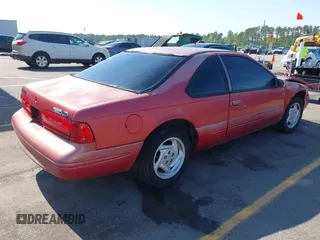 1996 Ford Thunderbird LX with VIN 1FALP62W0TH142986, listed as a IAAI auction lot 42030900 with 168,993 mi miles. Bid and sale history available at carsss.com. Image 4.