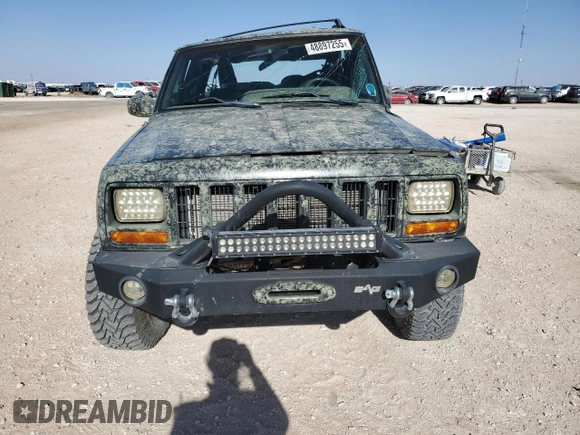 1999 Jeep Cherokee Sport with VIN 1J4FF68S6XL645028, listed as a Copart auction lot 48897255 with 218,552 mi miles and Salvage Title. Bid and sale history available at carsss.com. Image 5.