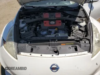 2011 Nissan 370Z Touring z VIN JN1AZ4EH7BM551606, wystawiony jako Copart lot #57173945 z przebiegiem Nie podano mil oraz Szkoda całkowita • Salvage title. Historia ofert i sprzedaży dostępna na DreamBid. Obrazek 11.