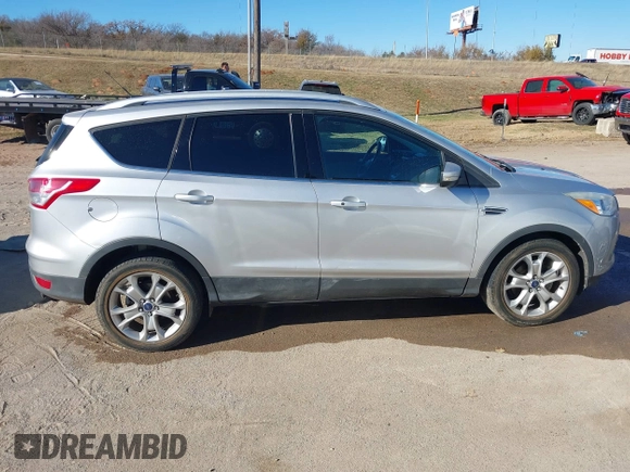2014 Ford Escape Titanium with VIN 1FMCU0JX7EUC59643, listed as a IAAI auction lot 41082952 with 143,899 mi miles. Bid and sale history available at carsss.com. Image 14.
