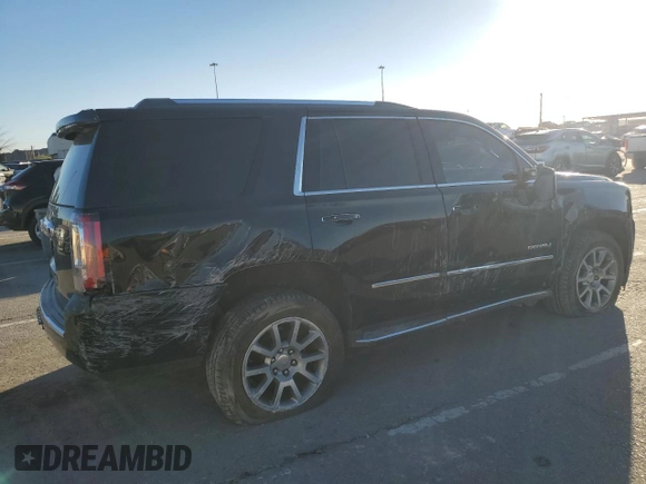 2018 GMC Yukon Denali with VIN 1GKS1CKJ0JR106589, listed as a Copart auction lot 79977034 with 98,022 mi miles and Salvage Title. Bid and sale history available at carsss.com. Image 3.