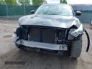 2014 Infiniti QX70 с VIN JN8CS1MU8EM450820, выставлен на аукционе IAAI как лот 42789920 с пробегом 140 621 миль миль и . История ставок и продаж доступна на DreamBid. Изображение 6.