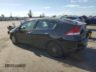 2010 Honda Insight LX with VIN JHMZE2H50AS009869, listed as a Copart auction lot 53031515 with 194,860 mi miles and Salvage Title. Bid and sale history available at DreamBid. Image 2.