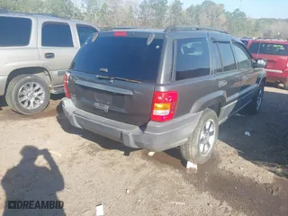 2004 Jeep Grand Cherokee Laredo with VIN 1J4GX48S44C394429, listed as a IAAI auction lot 41802203 with 144,925 mi miles. Bid and sale history available at carsss.com. Image 4.