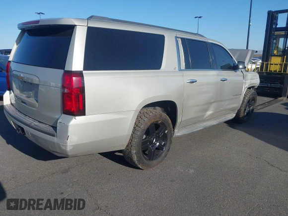 2015 Chevrolet Suburban LT z VIN 1GNSCJKC1FR608117, wystawiony jako IAAI lot #41641560 z przebiegiem 163 770 mil mil oraz . Historia ofert i sprzedaży dostępna na DreamBid. Obrazek 4.