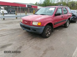 1998 Isuzu Rodeo S z VIN 4S2CK58WXW4325645, wystawiony jako IAAI lot #42013228 z przebiegiem 300 698 mil mil oraz . Historia ofert i sprzedaży dostępna na DreamBid. Obrazek 17.