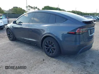 2022 Tesla Model X with VIN 7SAXCDE54NF342256, listed as a IAAI auction lot 41991212 with 28,740 mi miles and . Bid and sale history available at DreamBid. Image 3.