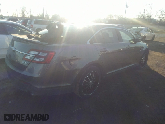 2014 Ford Taurus SHO with VIN 1FAHP2KT4EG140364, listed as a IAAI auction lot 35451709 with 82,904 mi miles. Bid and sale history available at carsss.com. Image 4.