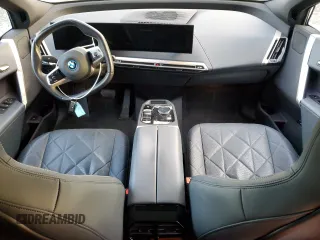 2022 BMW iX xDrive50 with VIN WB523CF05NCK62929, listed as a Copart auction lot 83295544 with 24,299 mi miles and Salvage Title. Bid and sale history available at carsss.com. Image 8.