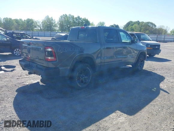 2023 Ram 1500 Rebel with VIN 1C6SRFLT2PN677577, listed as a IAAI auction lot 41991668 with 20,507 mi miles and . Bid and sale history available at DreamBid. Image 4.