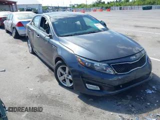 2015 Kia Optima LX with VIN KNAGM4A71F5634755, listed as a IAAI auction lot 42019729 with 101,064 mi miles. Bid and sale history available at carsss.com. Image 1.