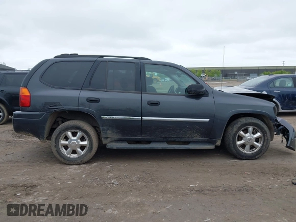 2007 GMC Envoy SLE z VIN 1GKDS13S572214421, wystawiony jako IAAI lot #42186747 z przebiegiem Nie podano mil oraz . Historia ofert i sprzedaży dostępna na DreamBid. Obrazek 13.
