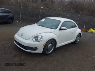 2012 Volkswagen Beetle 2.5L PZEV with VIN 3VWHP7AT9CM622739, listed as a IAAI auction lot 41674272 with 127,932 mi miles. Bid and sale history available at carsss.com. Image 2.