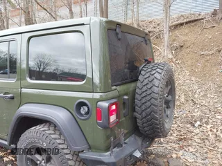 2021 Jeep Wrangler Unlimited Willys with VIN 1C4HJXDNXMW579595, listed as a IAAI auction lot 41930989 with 32,148 mi miles and . Bid and sale history available at DreamBid. Image 12.