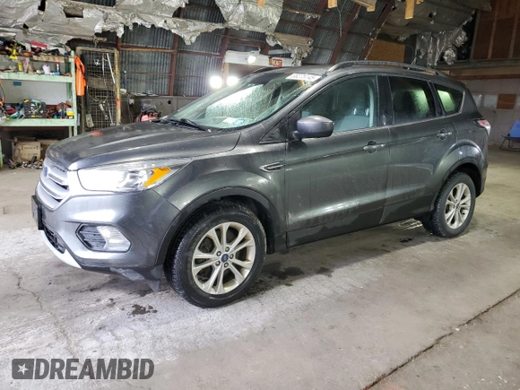 2018 Ford Escape SE z VIN 1FMCU9GD7JUA68705, wystawiony jako Copart lot #58275145 z przebiegiem 200 695 mil mil oraz Tytuł czysty. Historia ofert i sprzedaży dostępna na DreamBid. Obrazek 1.