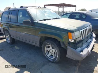 1996 Jeep Grand Cherokee Laredo with VIN 1J4GZ58S7TC280276, listed as a IAAI auction lot 42120454 with 230,617 mi miles. Bid and sale history available at carsss.com. Image 1.
