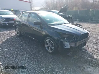 2018 Ford Focus SE z VIN 1FADP3FE9JL255818, wystawiony jako IAAI lot #42009017 z przebiegiem 79 329 mil mil oraz . Historia ofert i sprzedaży dostępna na DreamBid. Obrazek 1.