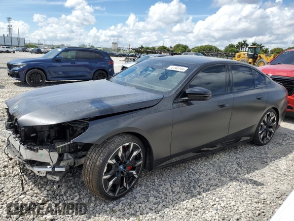 2024 BMW i5 M60 with VIN WBY43FK00RCR71826, listed as a Copart auction lot 72140144 with 5,987 mi miles and Salvage Title. Bid and sale history available at carsss.com. Image 1.