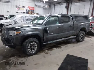2016 Toyota Tacoma SR5 with VIN 3TMDZ5BNXGM009423, listed as a IAAI auction lot 41008068 with 107,426 mi miles and . Bid and sale history available at DreamBid. Image 17.