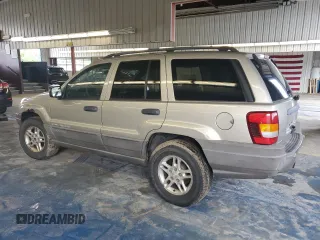 2003 Jeep Grand Cherokee Laredo with VIN 1J4GW48S43C567559, listed as a Copart auction lot 61431595 with 249,998 mi miles and Salvage title. Bid and sale history available at DreamBid. Image 2.