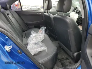 2015 Mitsubishi Lancer Evolution GSR z VIN JA32W8FV7FU023106, wystawiony jako Copart lot #40867084 z przebiegiem 103 964 mil mil oraz Szkody całkowita. Historia ofert i sprzedaży dostępna na DreamBid. Obrazek 10.