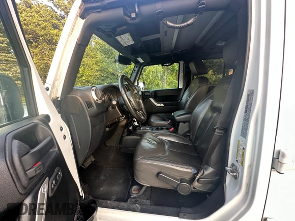 2016 Jeep Wrangler Unlimited Sahara with VIN 1C4BJWEG5GL215915, listed as a Copart auction lot 61690145 with 143,925 mi miles and Clean title. Bid and sale history available at DreamBid. Image 13.