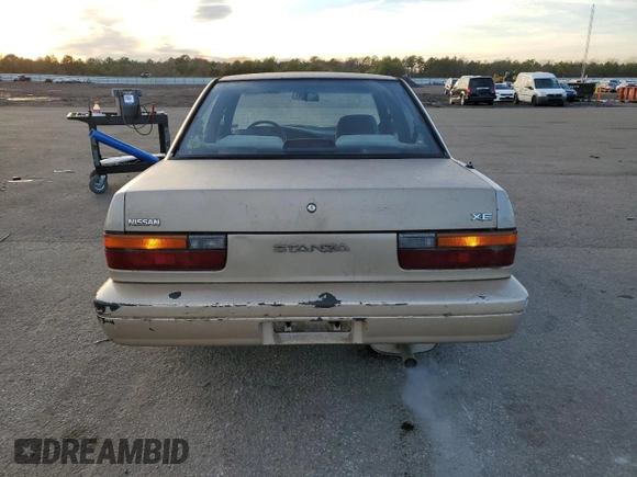 1990 Nissan Stanza GXE z VIN JN1FU21P9LX822087, wystawiony jako Copart lot #82967984 z przebiegiem 109 985 mil mil oraz Czysty tytuł • Clean title. Historia ofert i sprzedaży dostępna na DreamBid. Obrazek 6.