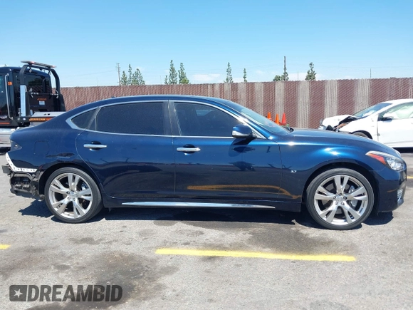 2015 Infiniti Q70 with VIN JN1BY1PP8FM601834, listed as a IAAI auction lot 42028330 with 106,285 mi miles and . Bid and sale history available at DreamBid. Image 13.