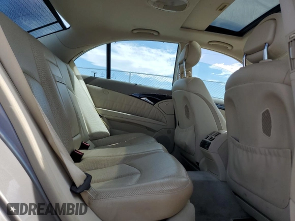 2004 Mercedes-Benz E-Class 5.0L with VIN WDBUF70J54A496963, listed as a Copart auction lot 64214634 with 113,575 mi miles and Salvage Title. Bid and sale history available at carsss.com. Image 10.