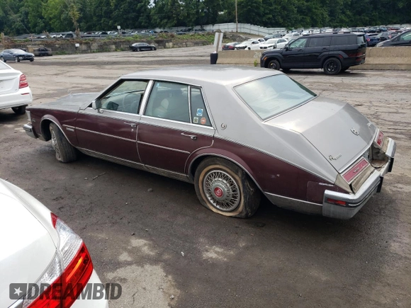 1983 Cadillac Seville z VIN 1G6AS6983DE800569, wystawiony jako Copart lot #62057784 z przebiegiem 50 322 mil mil oraz Czysty tytuł • Clean title. Historia ofert i sprzedaży dostępna na DreamBid. Obrazek 2.