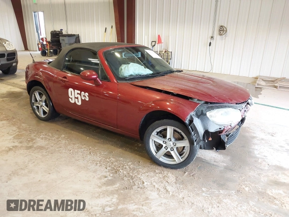 2007 Mazda MX-5 Miata Sport z VIN JM1NC25F970132299, wystawiony jako IAAI lot #41622791 z przebiegiem 72 392 mil mil oraz . Historia ofert i sprzedaży dostępna na DreamBid. Obrazek 1.
