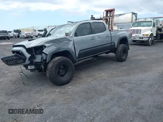 2018 Toyota Tacoma SR5 with VIN 3TMDZ5BN3JM039497, listed as a IAAI auction lot 42326823 with 92,977 mi miles and . Bid and sale history available at DreamBid. Image 2.
