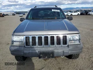1998 Jeep Grand Cherokee Laredo with VIN 1J4GZ58S7WC316522, listed as a Copart auction lot 80201994 with 217,465 mi miles and Clean Title. Bid and sale history available at carsss.com. Image 5.