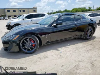 2014 Maserati GranTurismo Sport z VIN ZAM45VLAXE0083282, wystawiony jako Copart lot #61799155 z przebiegiem 71 517 mil mil oraz Szkoda całkowita • Salvage title. Historia ofert i sprzedaży dostępna na DreamBid. Obrazek 1.
