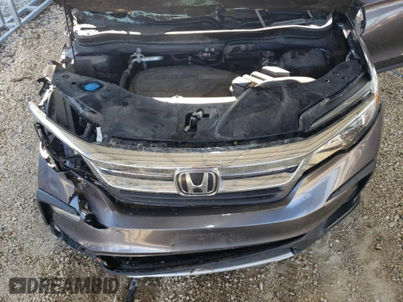 2020 Honda Pilot EX-L z VIN 5FNYF6H55LB042108, wystawiony jako Copart lot #63163755 z przebiegiem Nie podano mil oraz Szkoda całkowita • Salvage title. Historia ofert i sprzedaży dostępna na DreamBid. Obrazek 12.