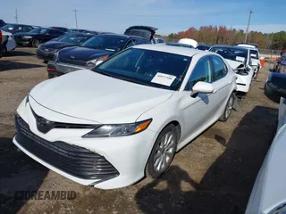 2020 Toyota Camry LE with VIN 4T1C11AKXLU986310, listed as a IAAI auction lot 40977100 with 108,208 mi miles and . Bid and sale history available at DreamBid. Image 18.