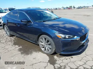 2018 Mazda 6 Grand Touring with VIN JM1GL1TY5J1336056, listed as a IAAI auction lot 41681905 with 93,538 mi miles and . Bid and sale history available at DreamBid. Image 1.