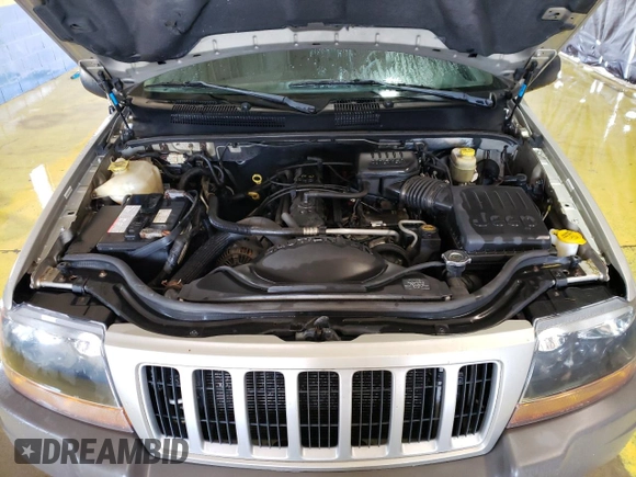 2004 Jeep Grand Cherokee Laredo z VIN 1J4GW48S24C327184, wystawiony jako Copart lot #53702515 z przebiegiem 151 411 mil mil oraz Czysty tytuł • Clean title. Historia ofert i sprzedaży dostępna na DreamBid. Obrazek 12.