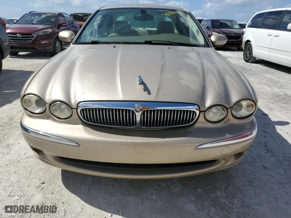 2004 Jaguar X-Type with VIN SAJEA51C34WE03194, listed as a Copart auction lot 78980144 with 51,164 mi miles and Clean Title. Bid and sale history available at carsss.com. Image 5.