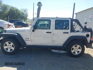 2007 Jeep Wrangler Unlimited X with VIN 1J4GB39147L133997, listed as a IAAI auction lot 41676009 with 110,849 mi miles and . Bid and sale history available at DreamBid. Image 14.