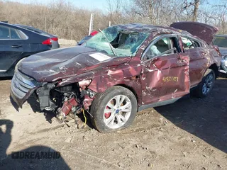 2012 Ford Taurus SEL z VIN 1FAHP2EWXCG123362, wystawiony jako IAAI lot #41821727 z przebiegiem 183 457 mil mil oraz . Historia ofert i sprzedaży dostępna na DreamBid. Obrazek 2.